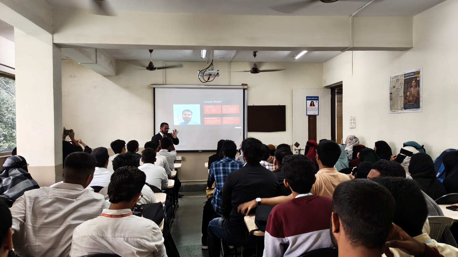 A speaker addressing a large audience at a Mohlight Foundation session